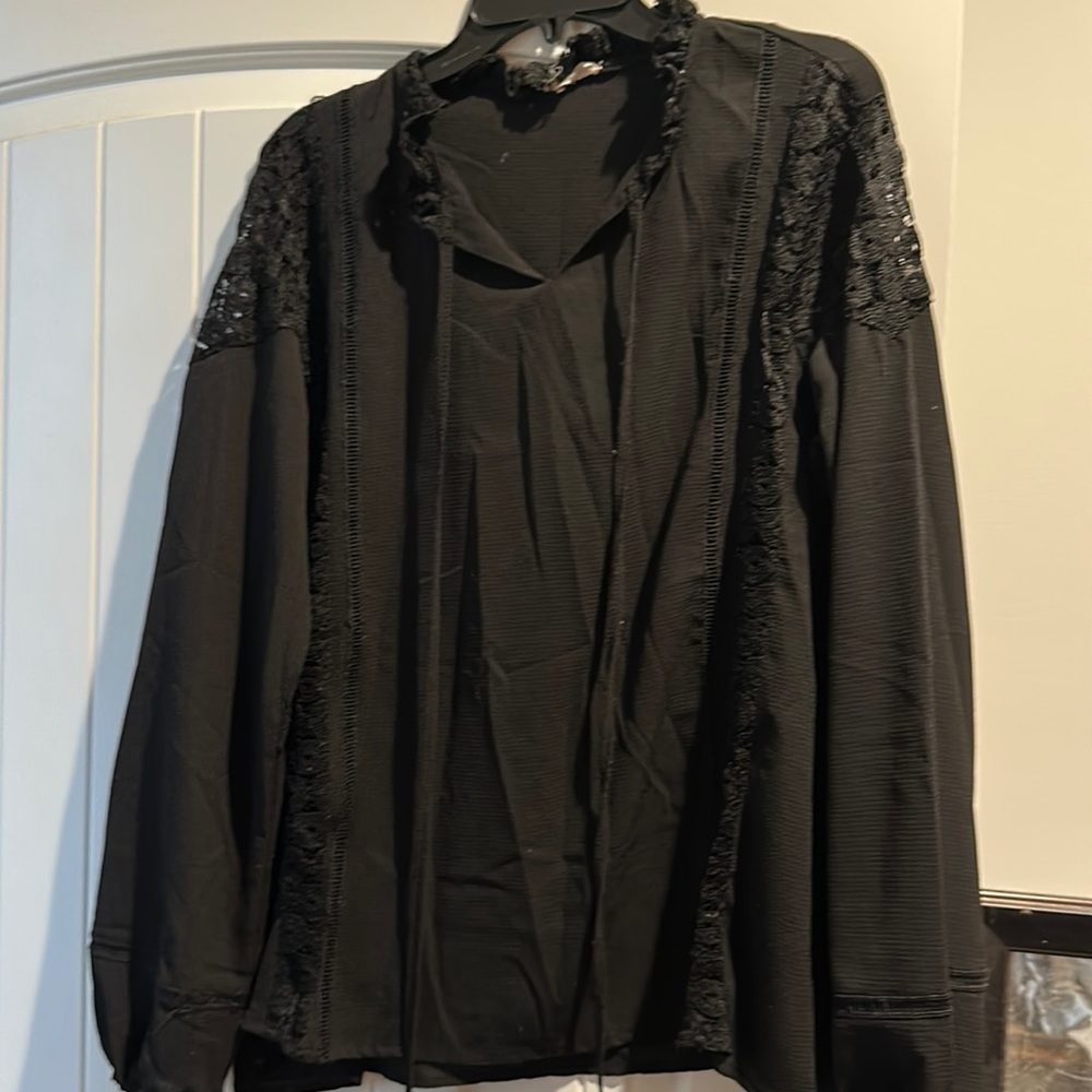 Black blouse with small cutouts